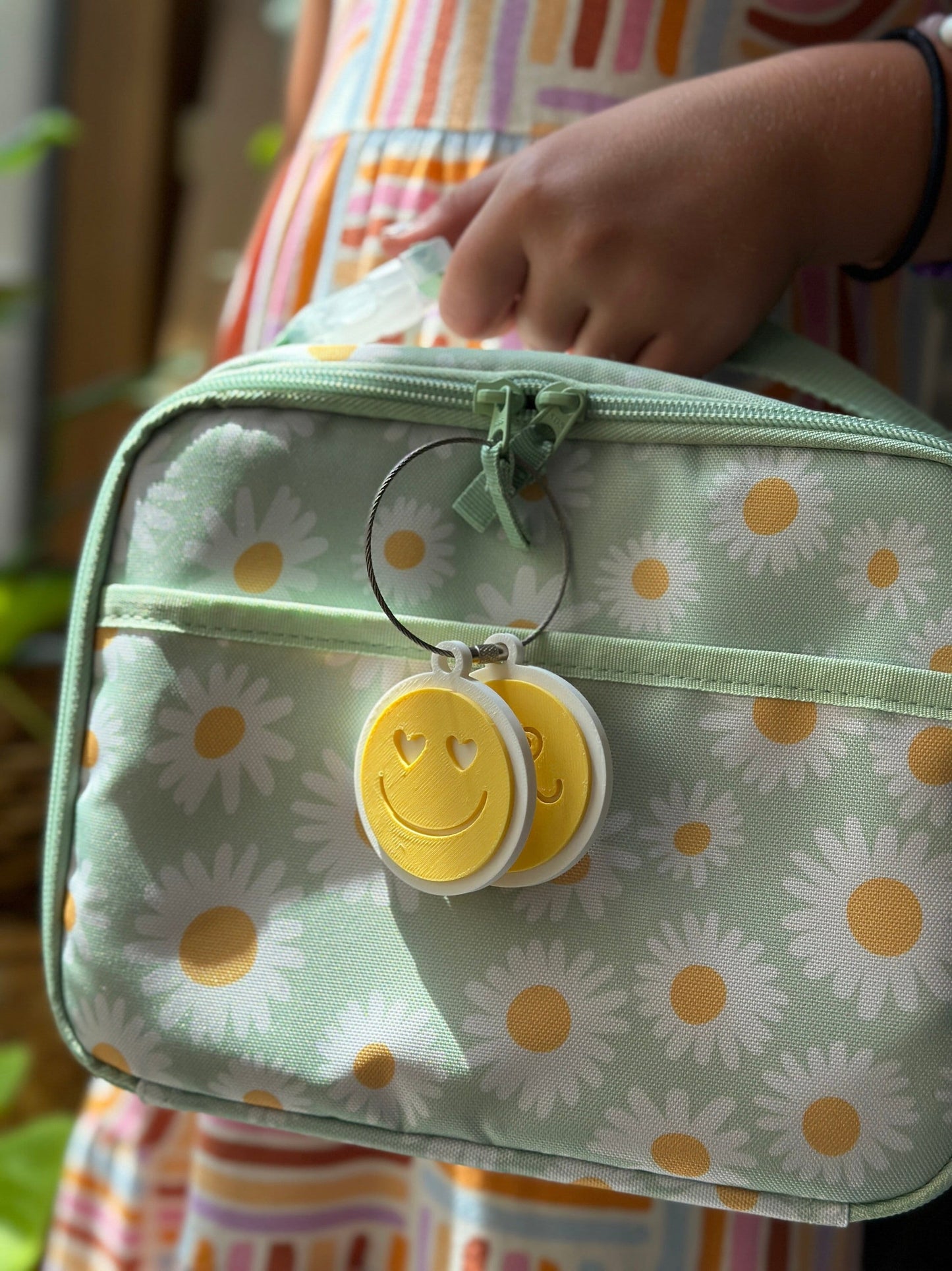 Personalized emoji bag tag on a kids lunch box — photo 1