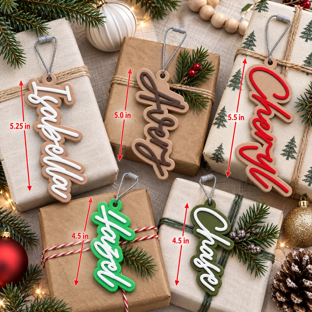 Flat lay of Modern Script stocking name tags with ornaments, showing how tag length changes with each name